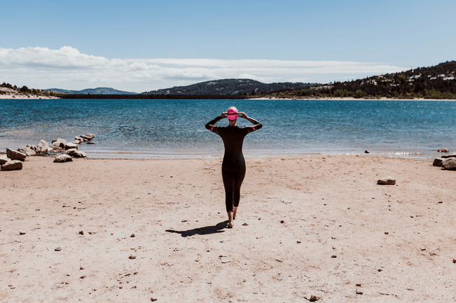 MIddle-aged woman going for a swim at the beach