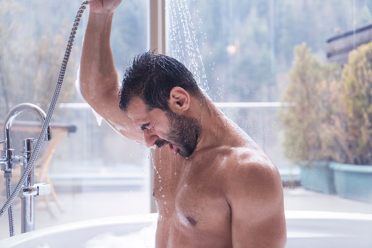 man taking a cold shower