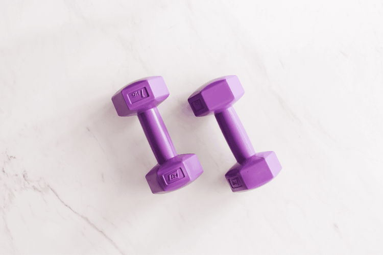 purple gym weights on the floor