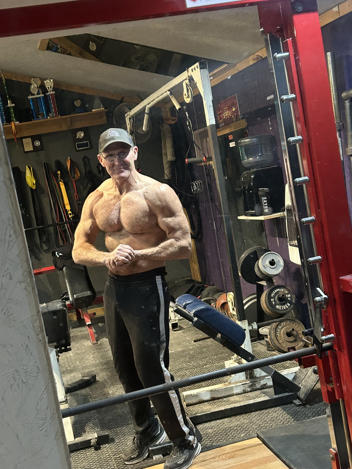 Verified customer Rick standing in his home gym