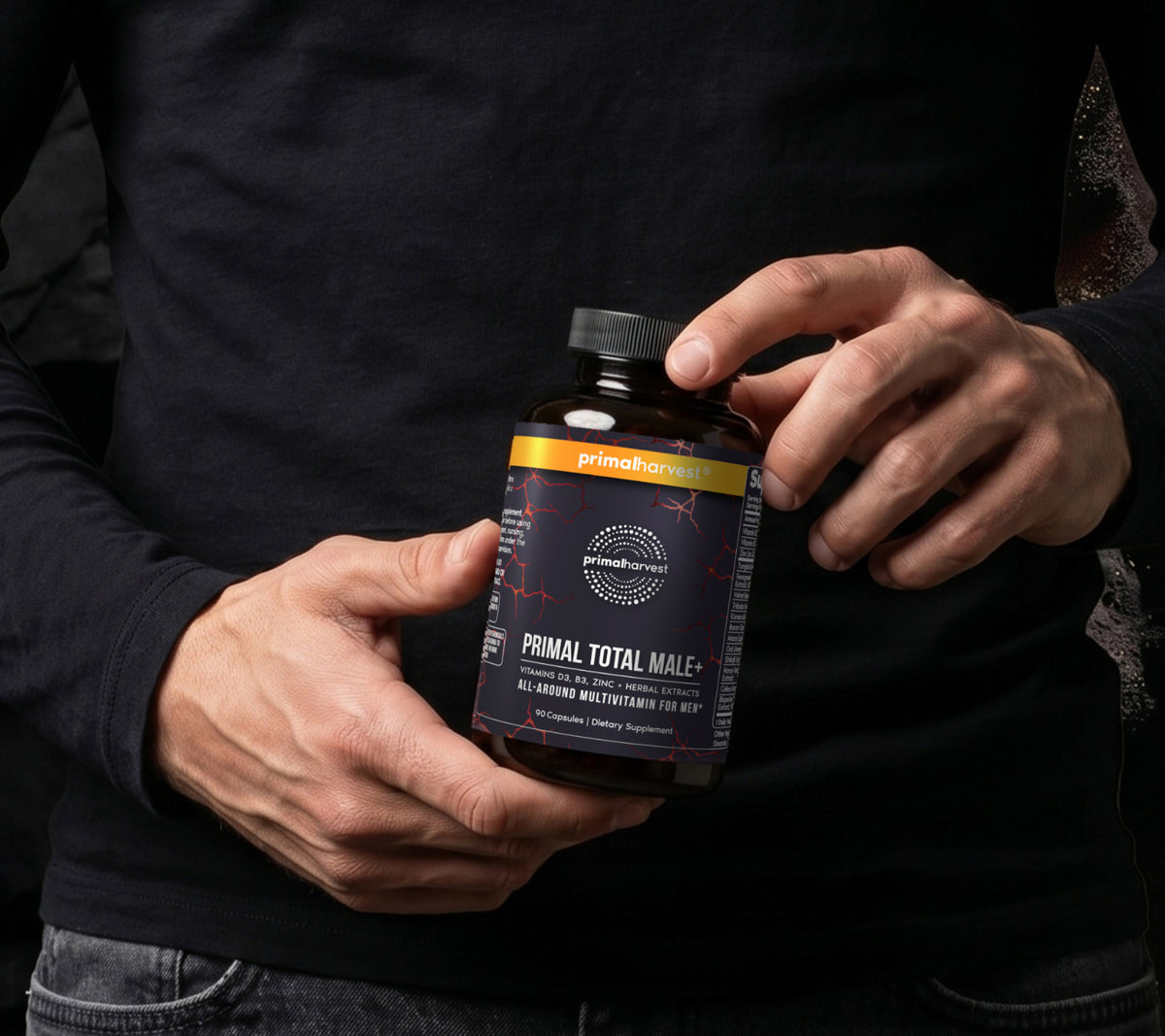 Man holding a bottle of Primal Total Male+